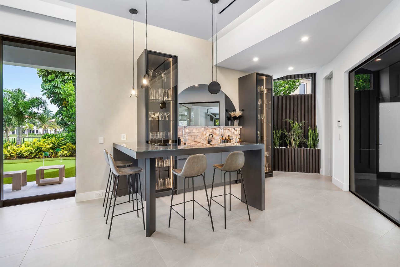Glass-enclosed wine room by RG Glass