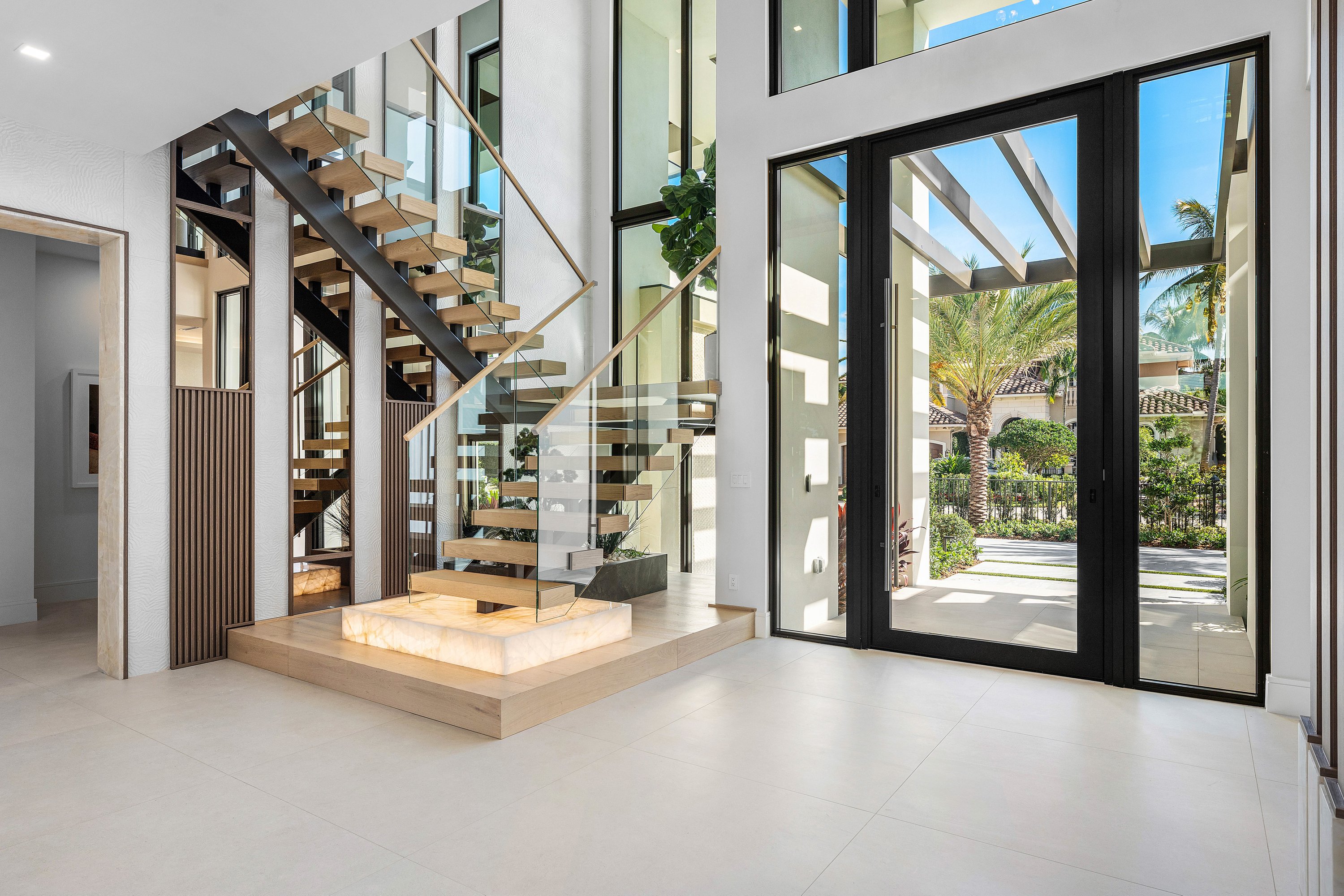 Modern South Florida interior with a frameless glass staircase railing by RG Glass