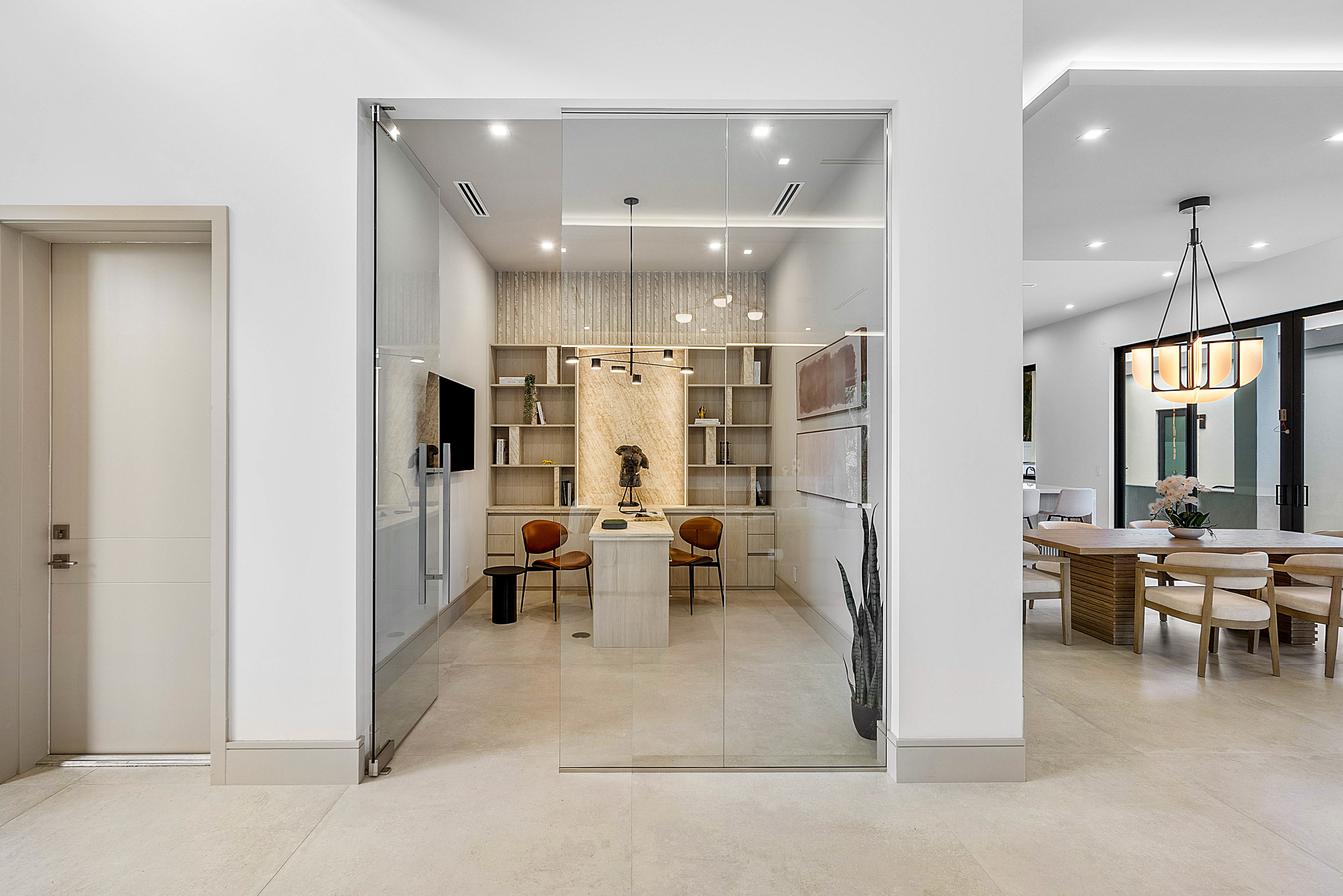 Frameless glass-enclosed home office partition by RG Glass