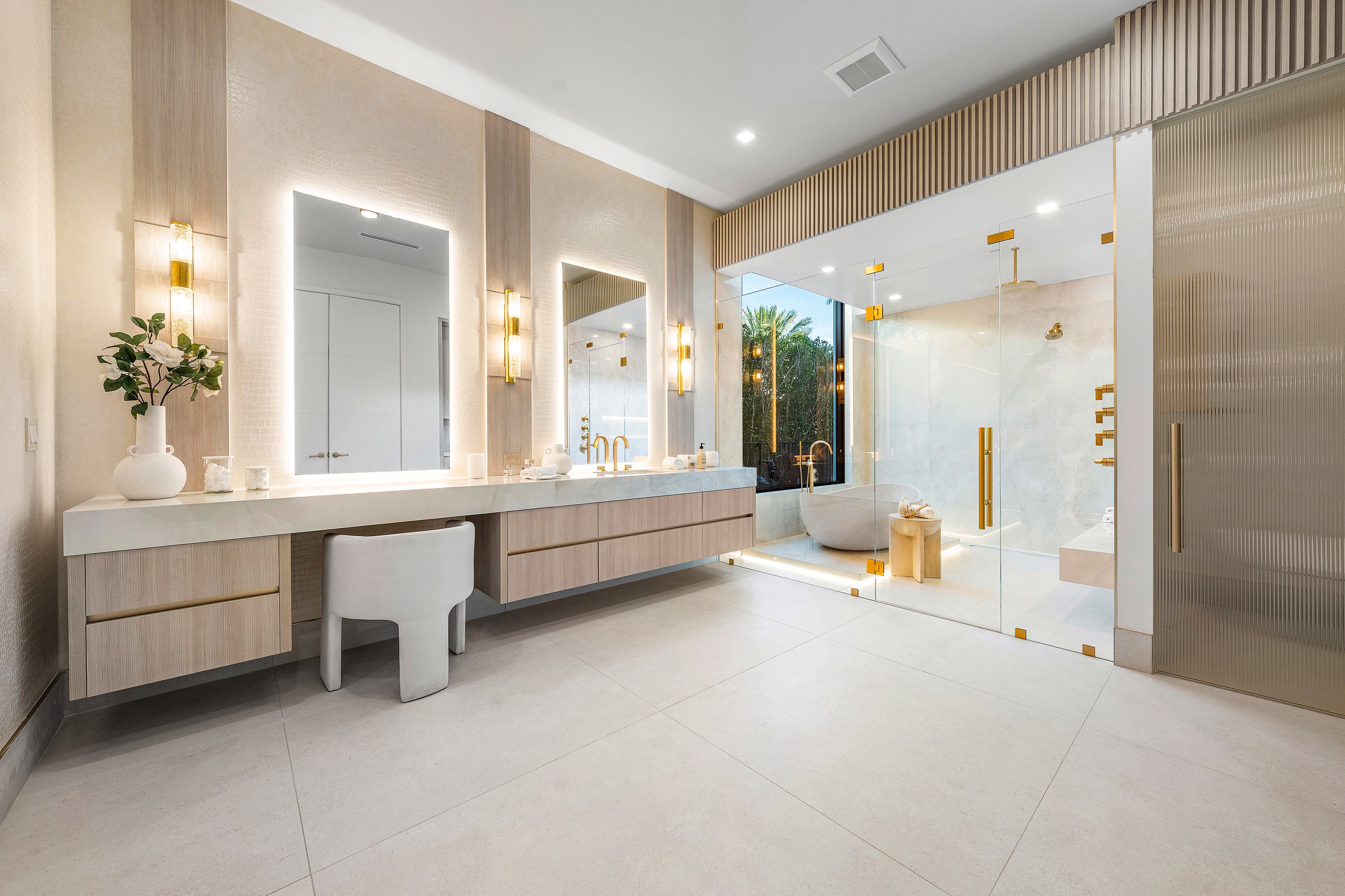 Frameless glass shower enclosure with custom hardware by RG Glass