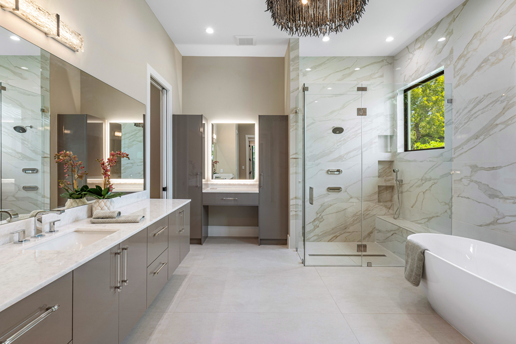 Frameless glass shower enclosure in a modern bathroom by RG Glass