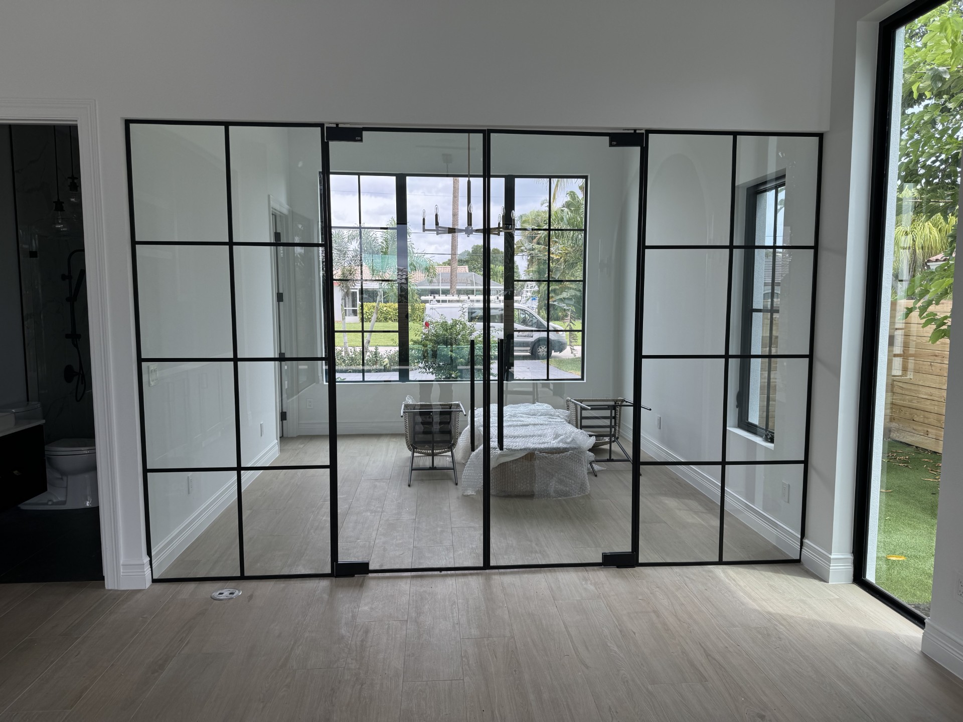 Black-framed glass partition and doors by RG Glass