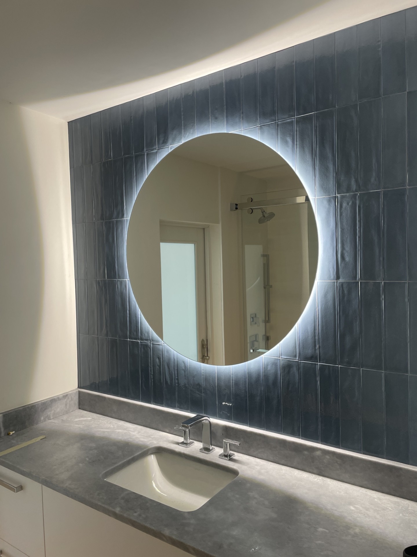 Round backlit custom mirror installed by RG Glass