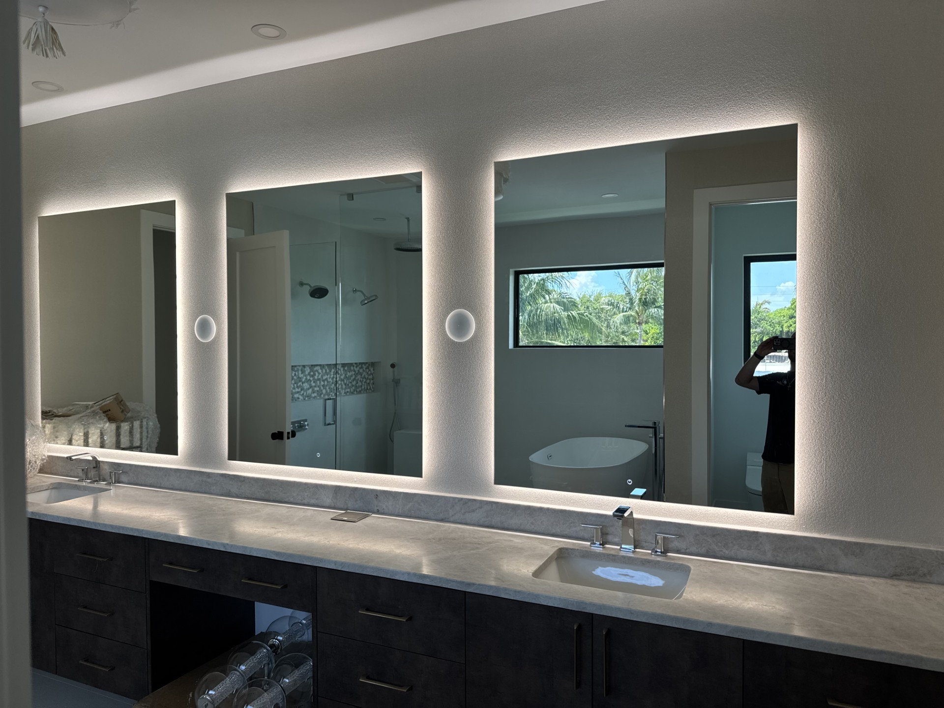 Triple backlit bathroom mirror installation by RG Glass