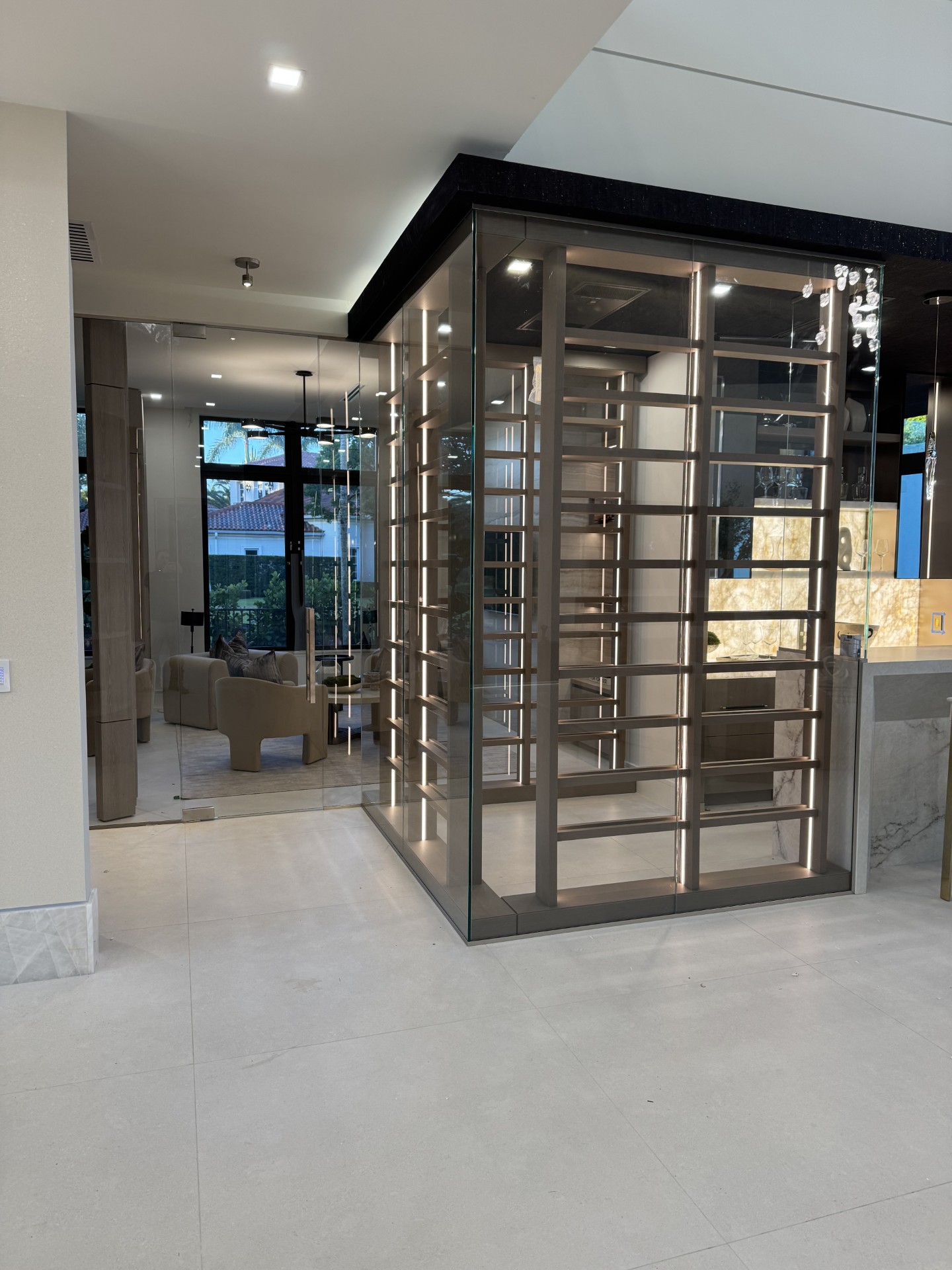 Glass-enclosed wine room by RG Glass