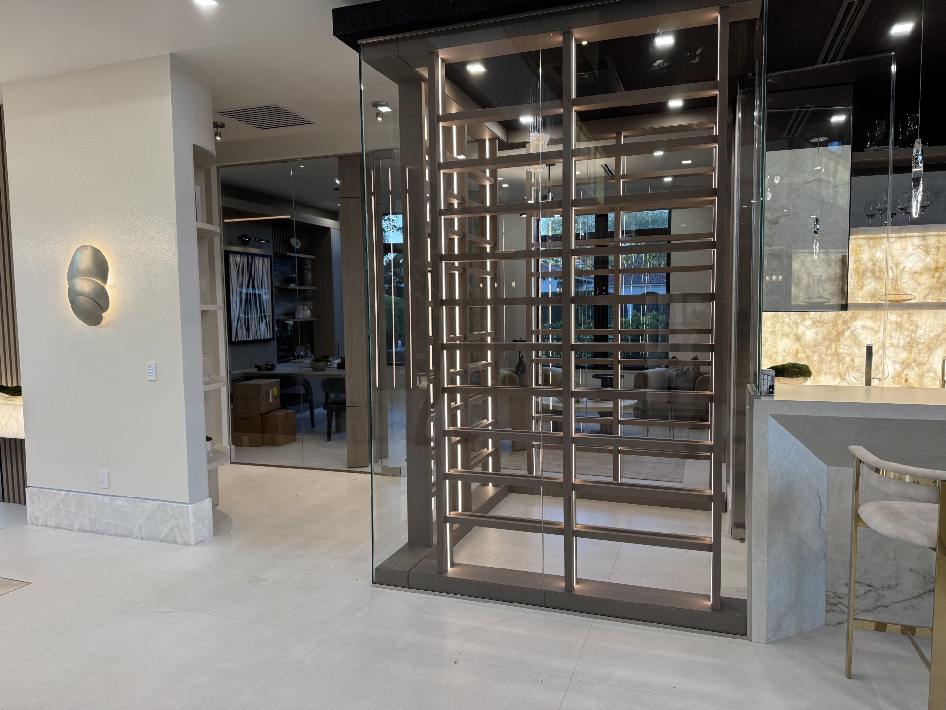 Glass wine room display with integrated lighting by RG Glass