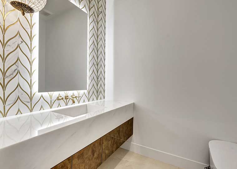 Ornate backlit custom glass mirror with gold detailing by RG Glass