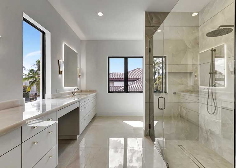 Frameless glass shower enclosure with backlit mirror by RG Glass
